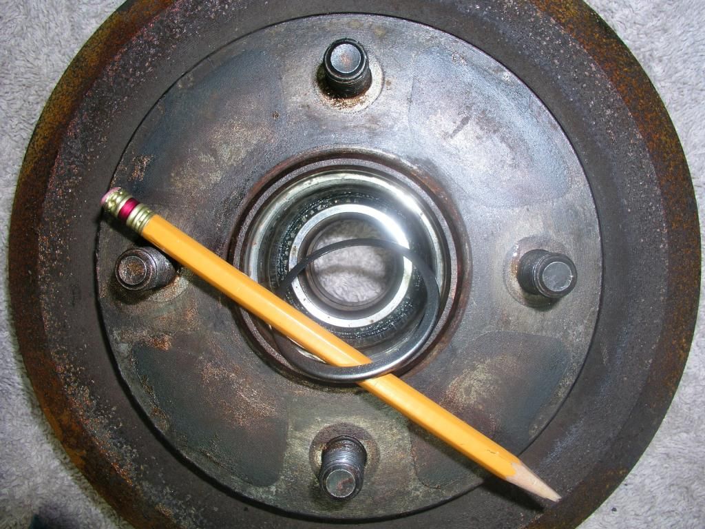 Rear wheel bearing failure? + Brake stuck ON + brake pads stuck onto